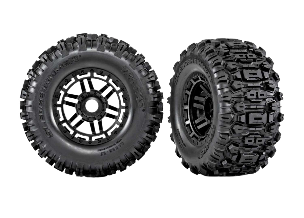 Two black off-road tires with belts on a white background, featuring the 'Belted' brand logo.