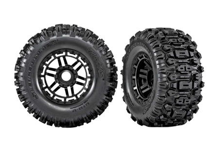 Two black off-road tires with belts on a white background, featuring the 'Belted' brand logo.