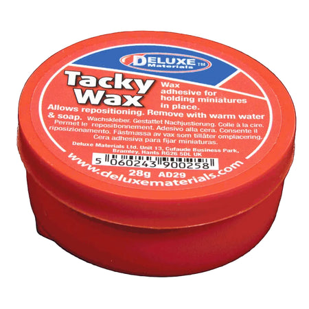 Red container of Deluxe Tacky Wax on a black background