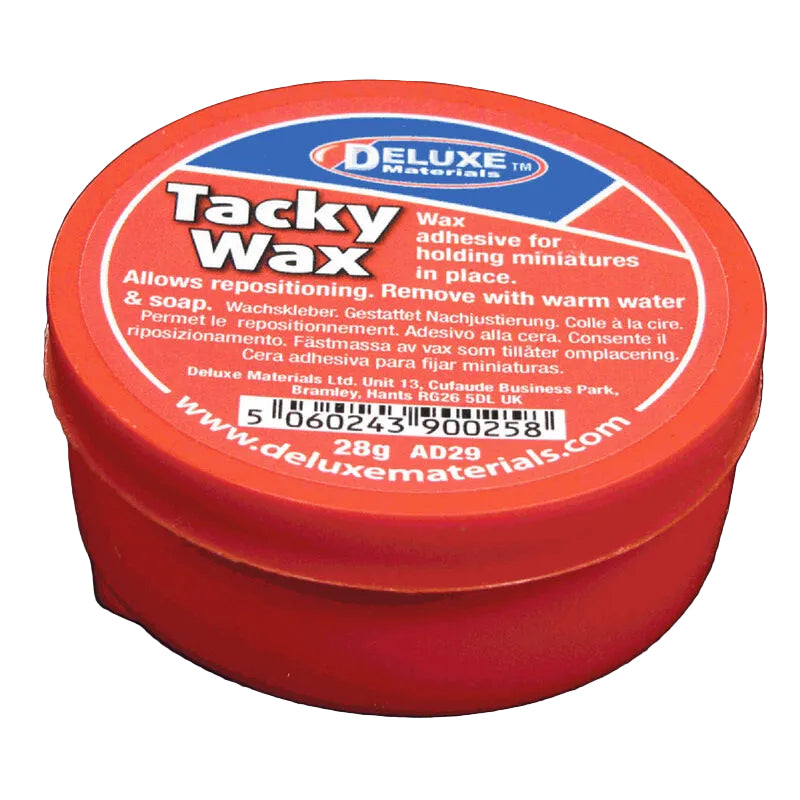 Red container of Deluxe Tacky Wax on a black background