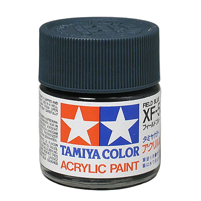 Tamiya Color acrylic paint jar with blue lid on a gray background